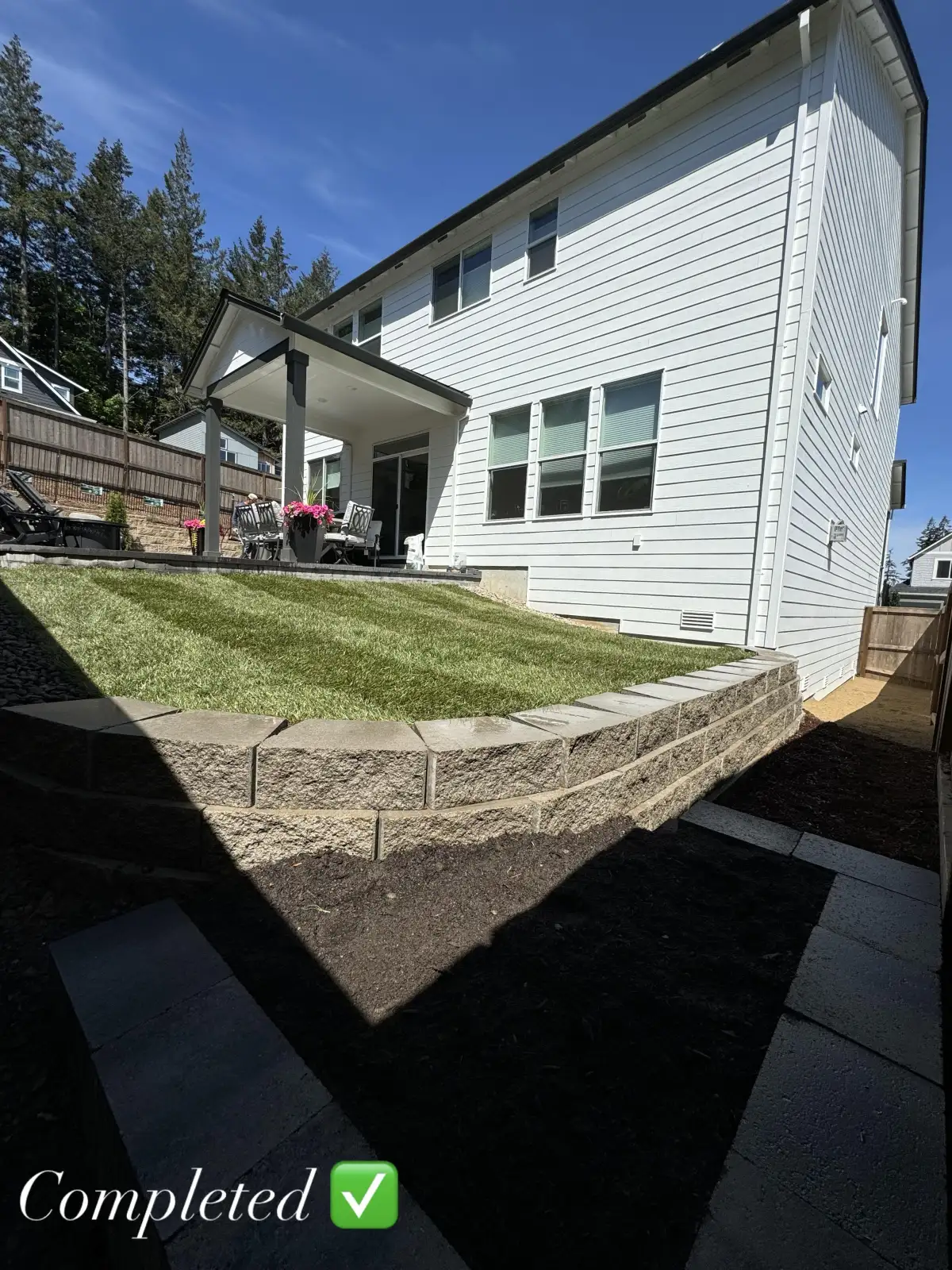 Designed landscape with retaining wall and patio in Oregon