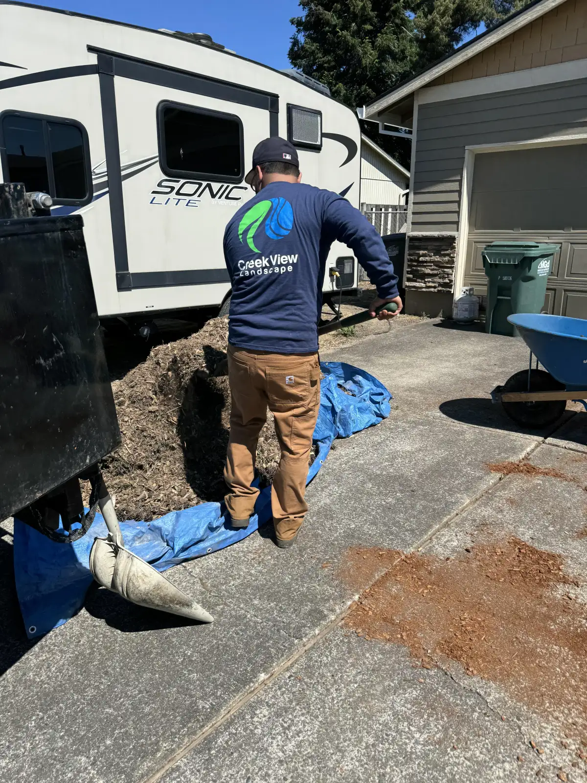 CreekView Landscape equipment on a Tigard renovation job site