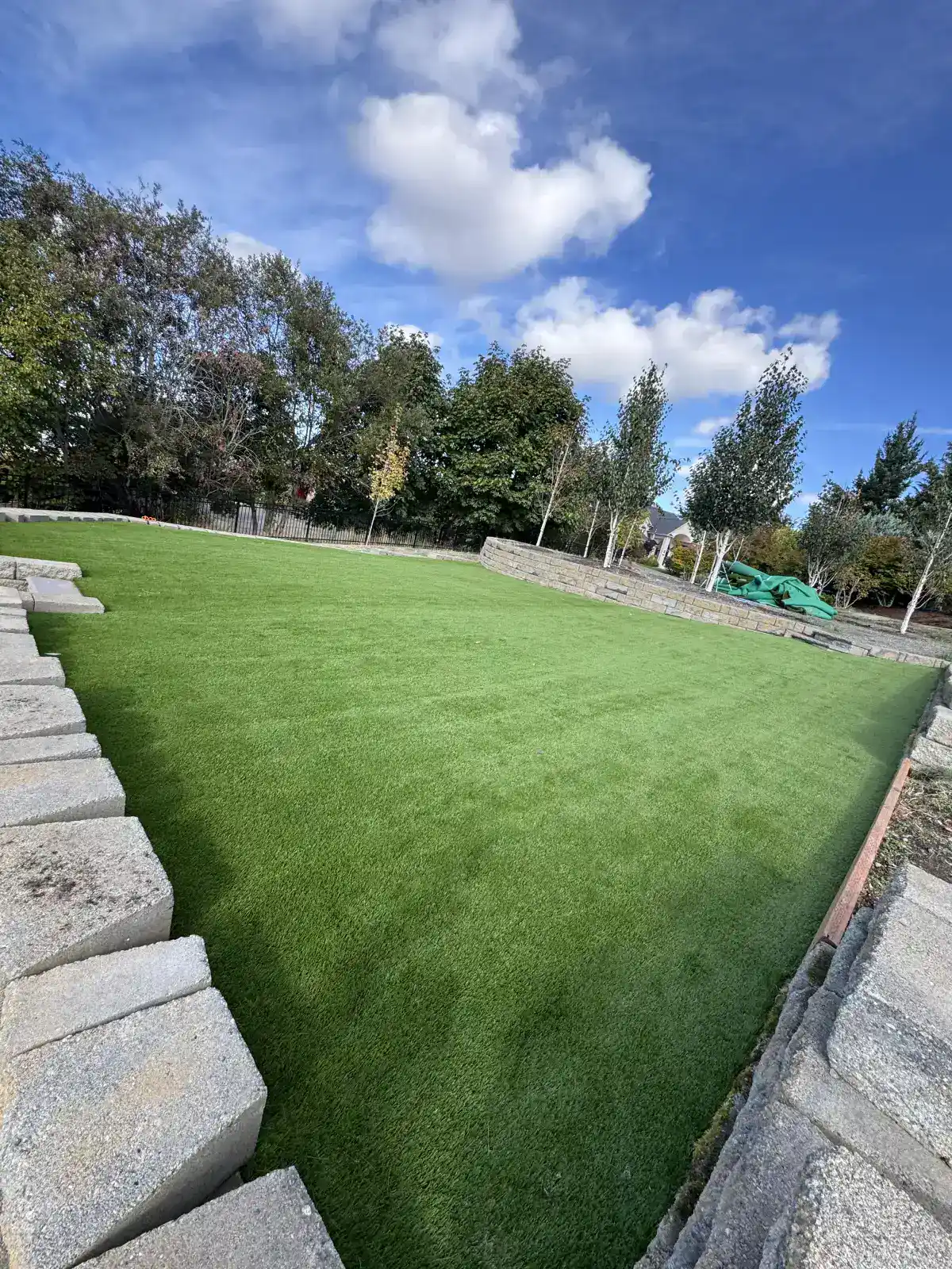 Artificial turf play area with clean edges in Oregon backyard
